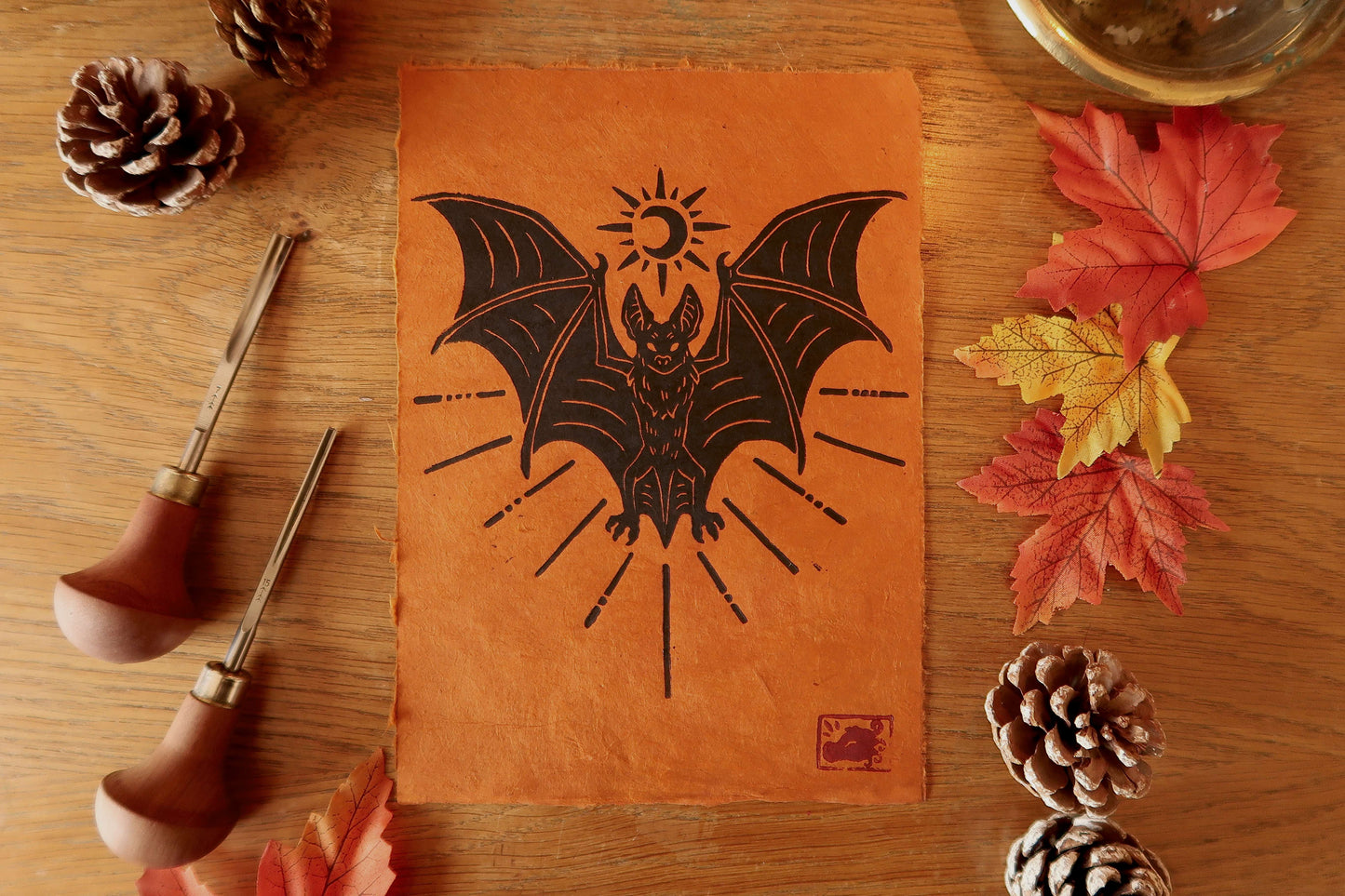 Bat - Linocut print on burnt orange paper