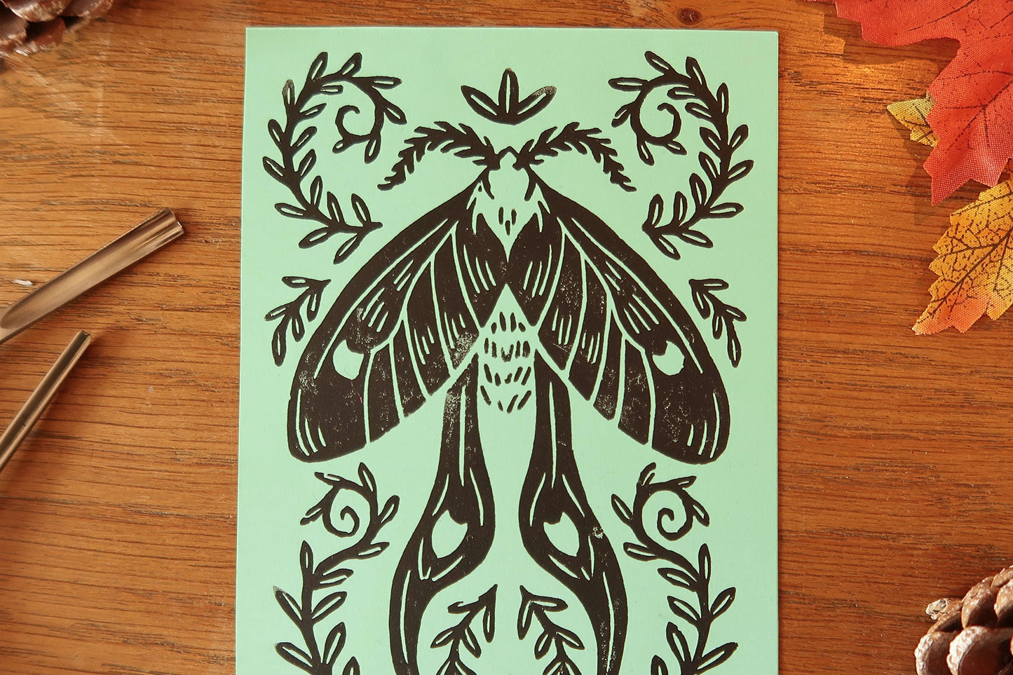 Tiny Moth - Linocut print on Mint colored paper