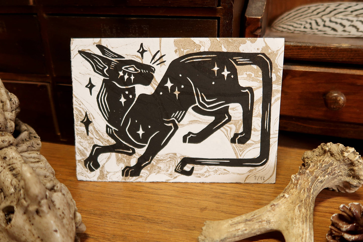 Star cat - Linocut print on white and gold marble paper
