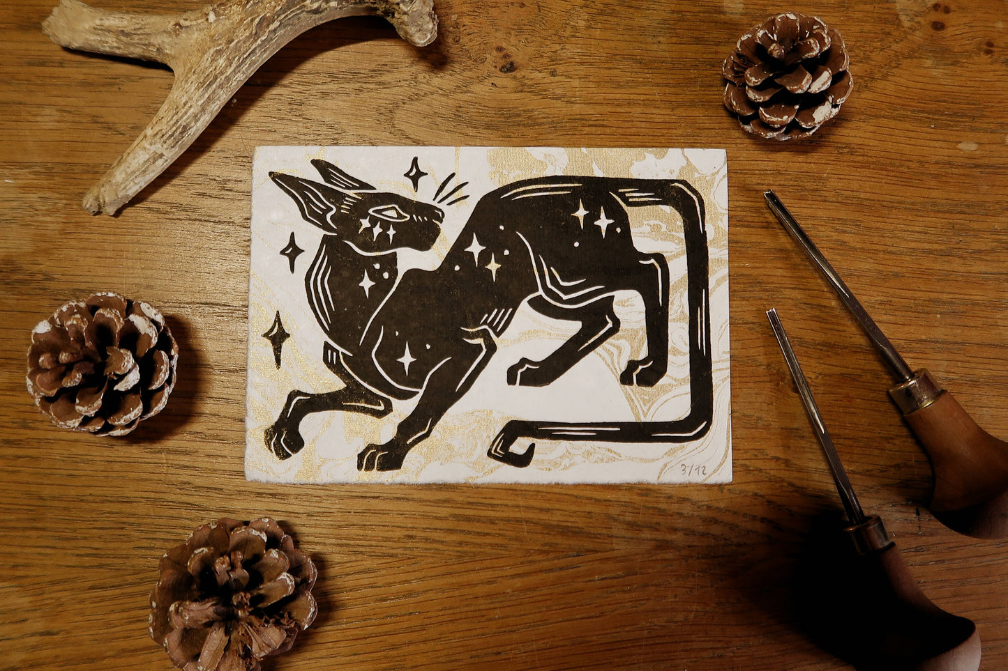 Star cat - Linocut print on white and gold marble paper