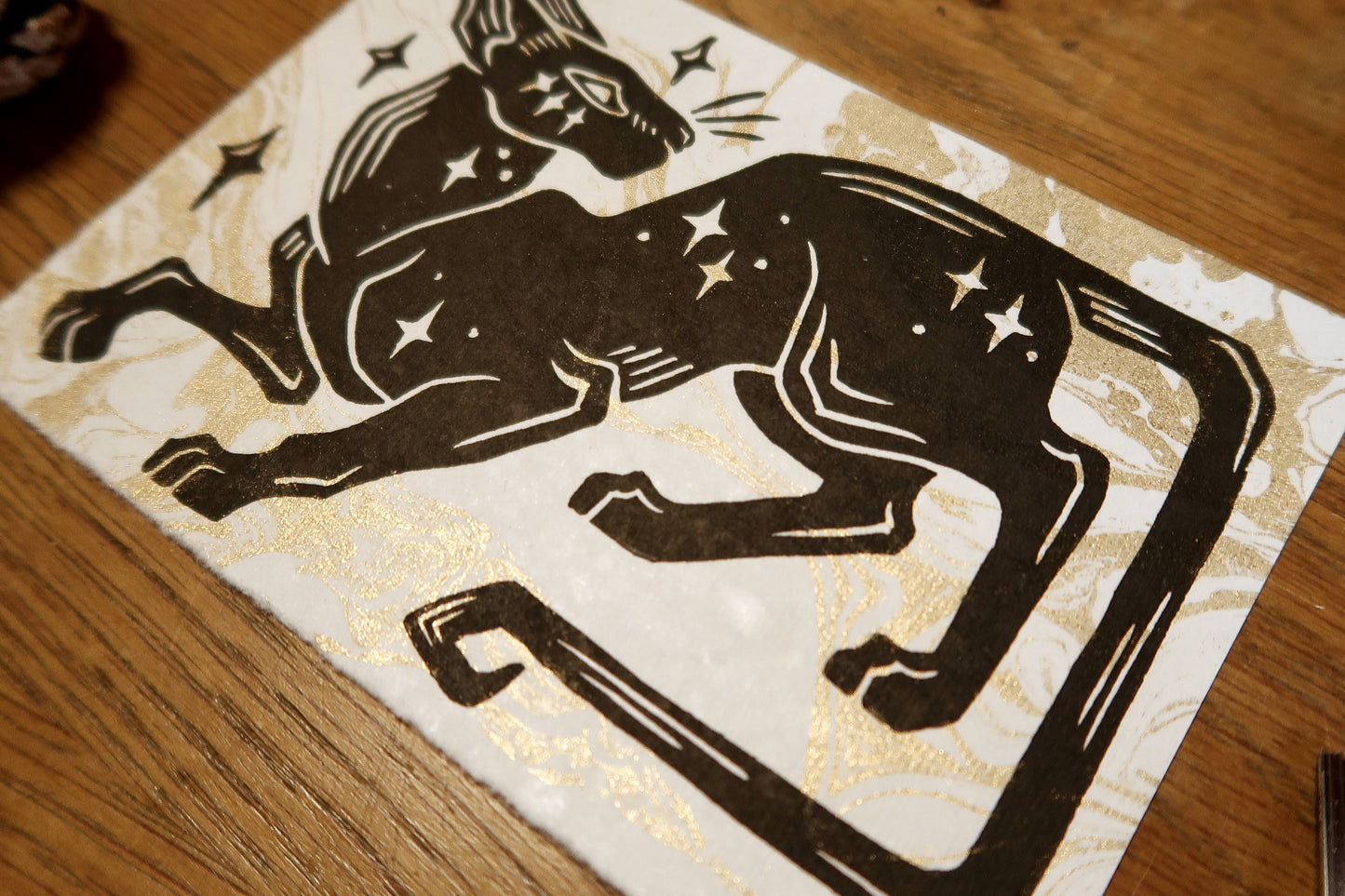 Star cat - Linocut print on white and gold marble paper