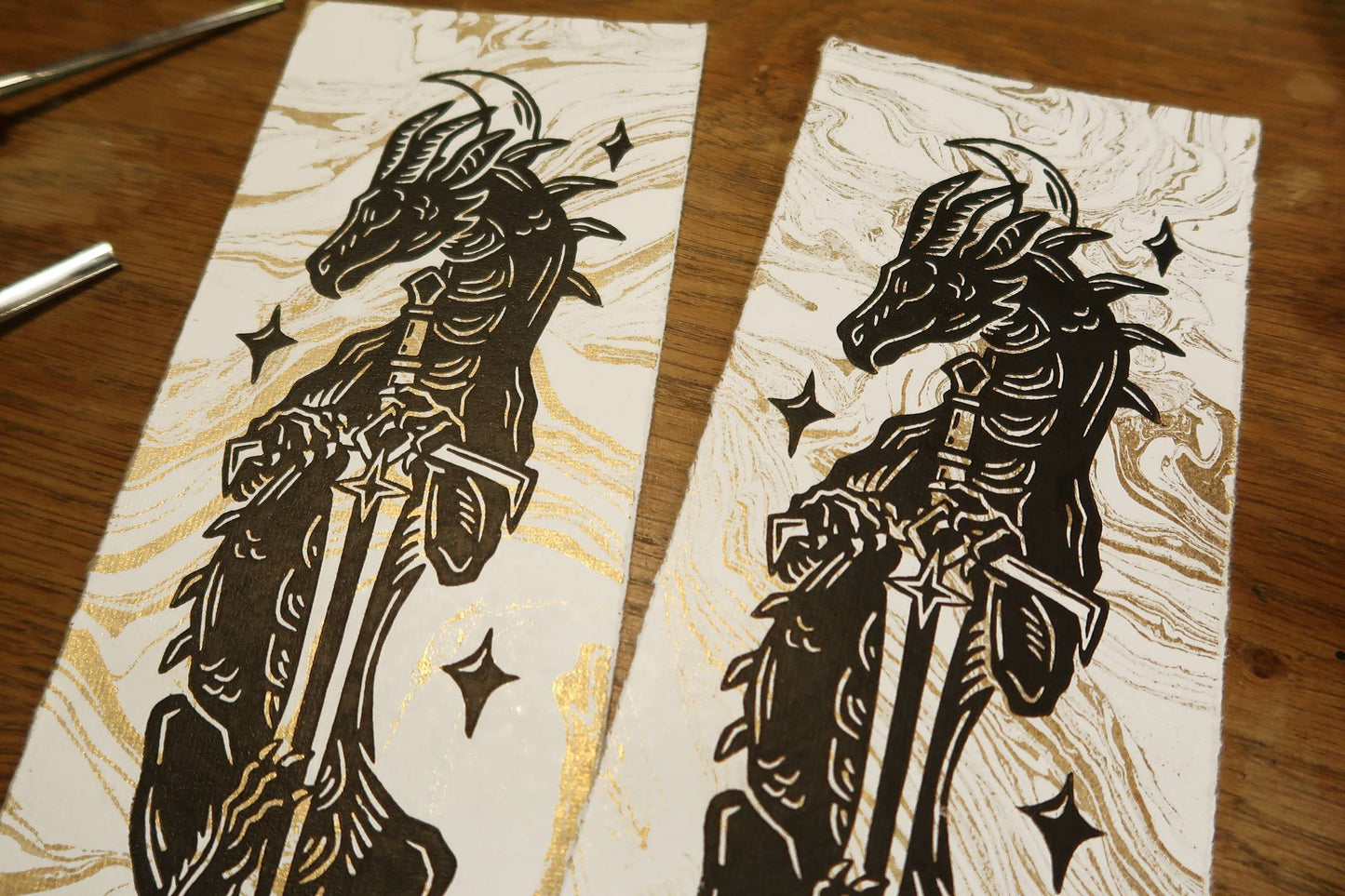 Sun and moon sword Dragons - Linocut print on gold marbled paper