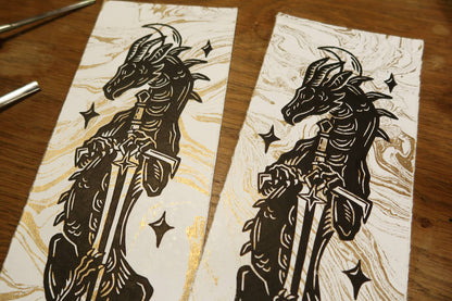 Sun and moon sword Dragons - Linocut print on gold marbled paper