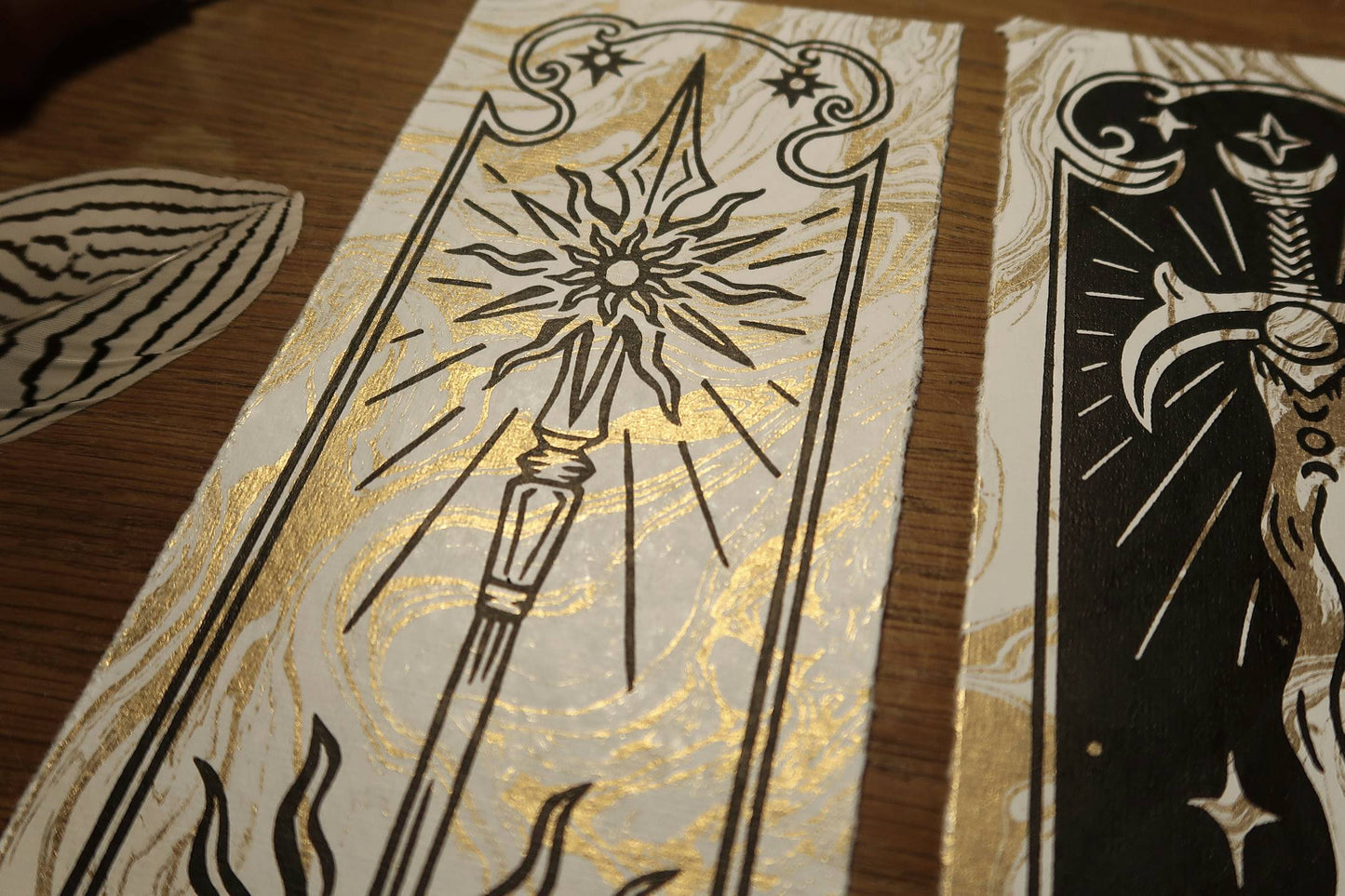 Medieval sword and spear  - Linocut print on gold marbled paper